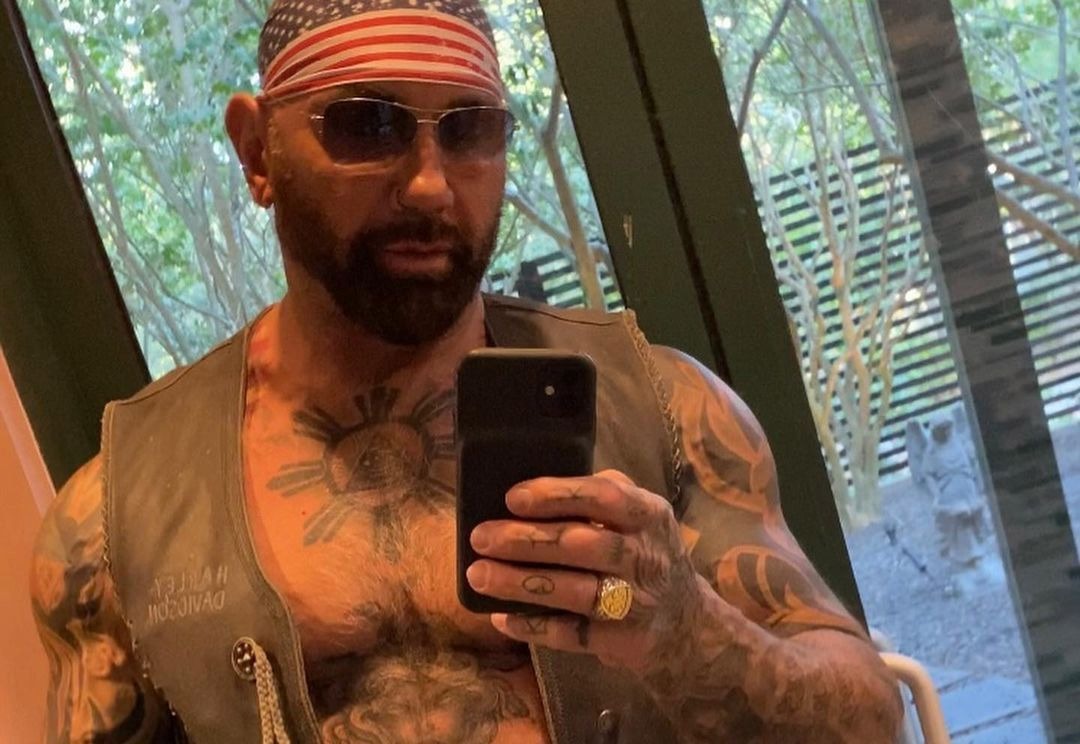 Dave Bautista tattoos across chest and arms