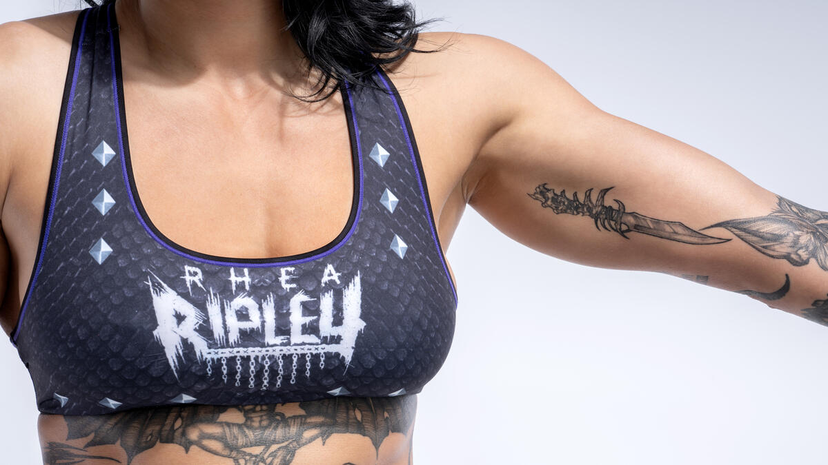 Rhea Ripley tattoos: Rhea Ripley dagger and arm tattoo collection