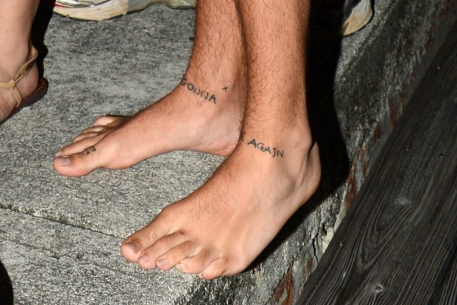 Harry Styles’s two ankle tattoos reading Never Gonna and Dance Again
