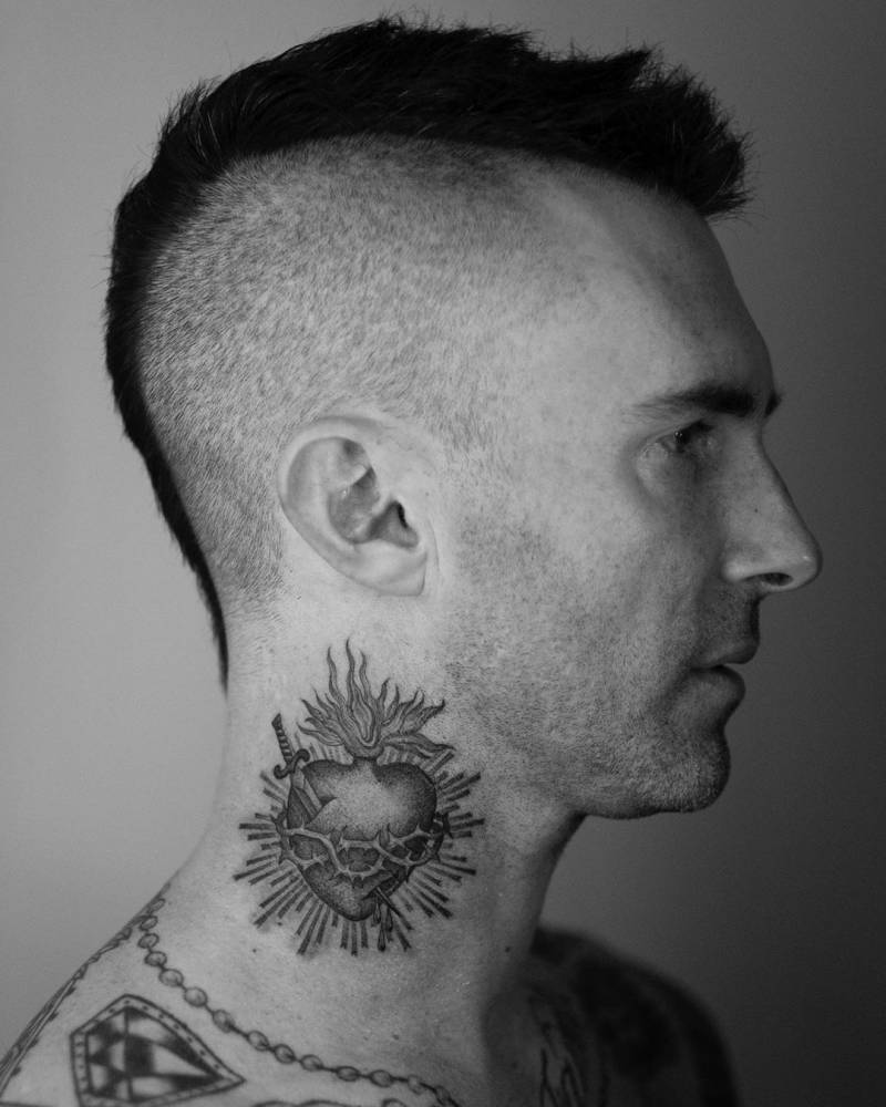 Adam Levine's sacred heart tattoo on the opposite side of his neck