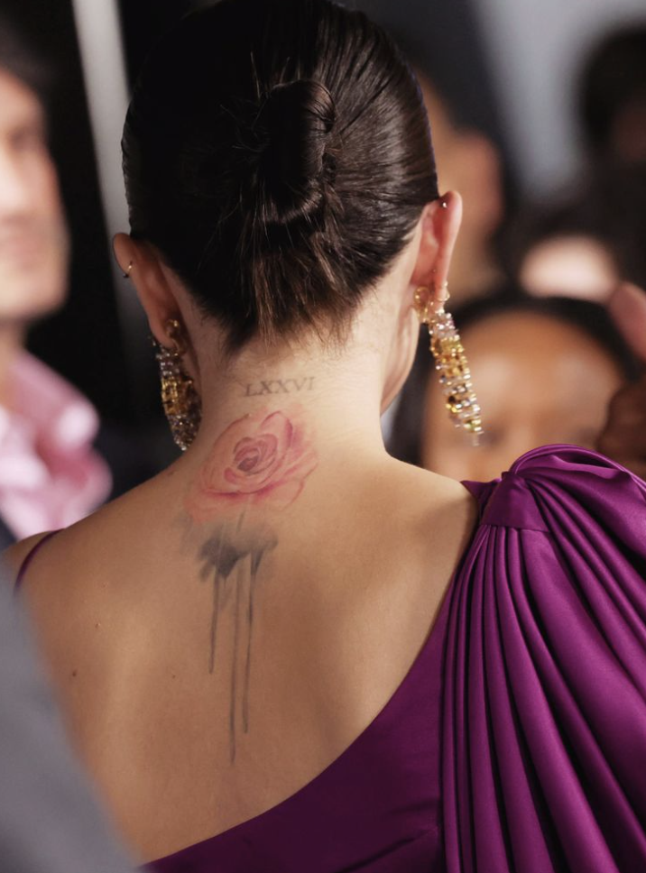 Selena Gomez’s pink rose tattoo across her upper back