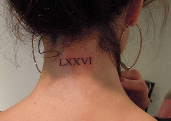 Close-up of Selena Gomez’s LXXVI Roman numeral tattoo at the nape of her neck