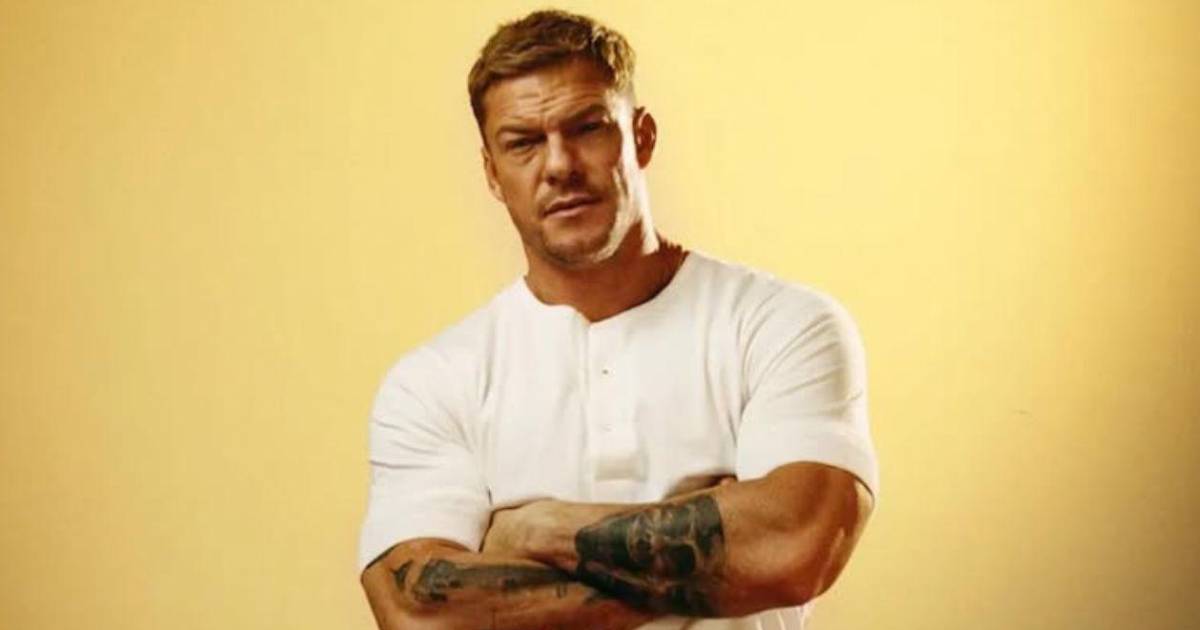 Alan Ritchson with tattoos visible on both forearms, showing the collection discussed across the article.