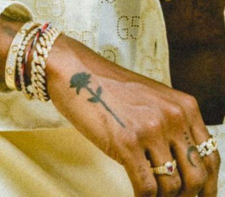6LACK’s small rose tattoo on the back of his hand