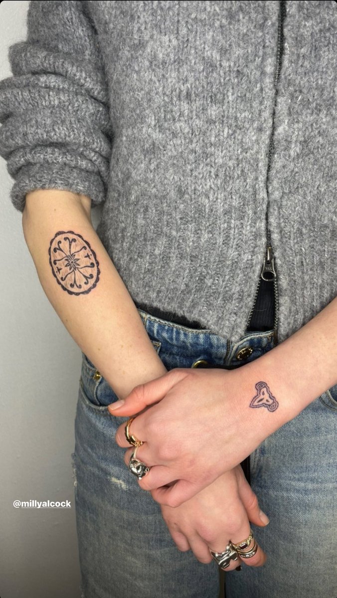 Milly Alcock tattoos: Milly Alcock floral oval forearm tattoo and small knot tattoo