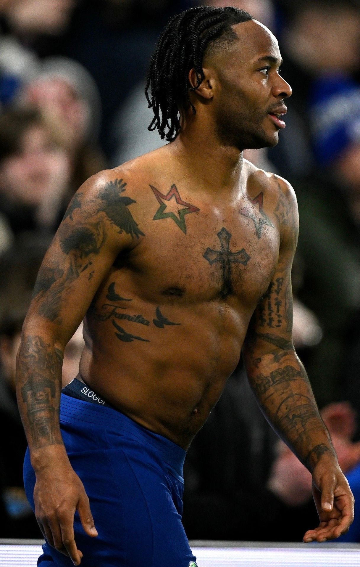 Raheem Sterling tattoos: large sharp photograph showing the stars, cross, birds and Familia lettering