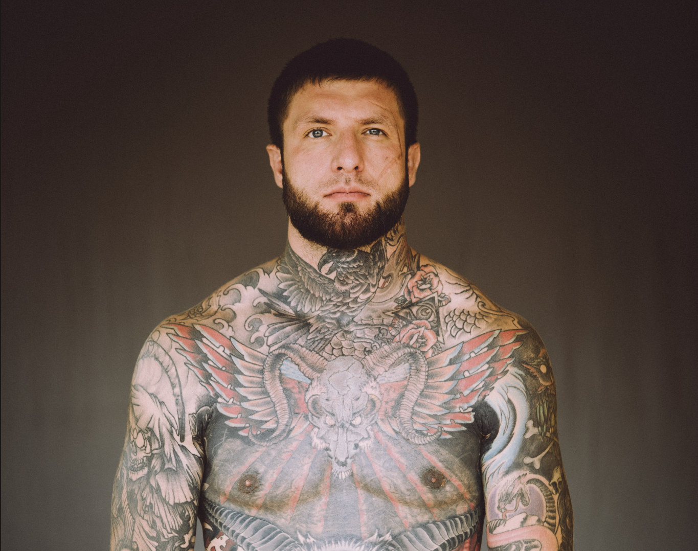 Alex Terrible chest and neck tattoos