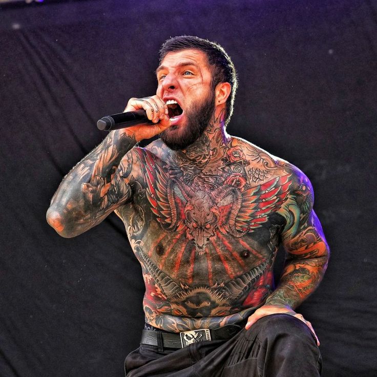 Alex Terrible winged skull stage tattoos
