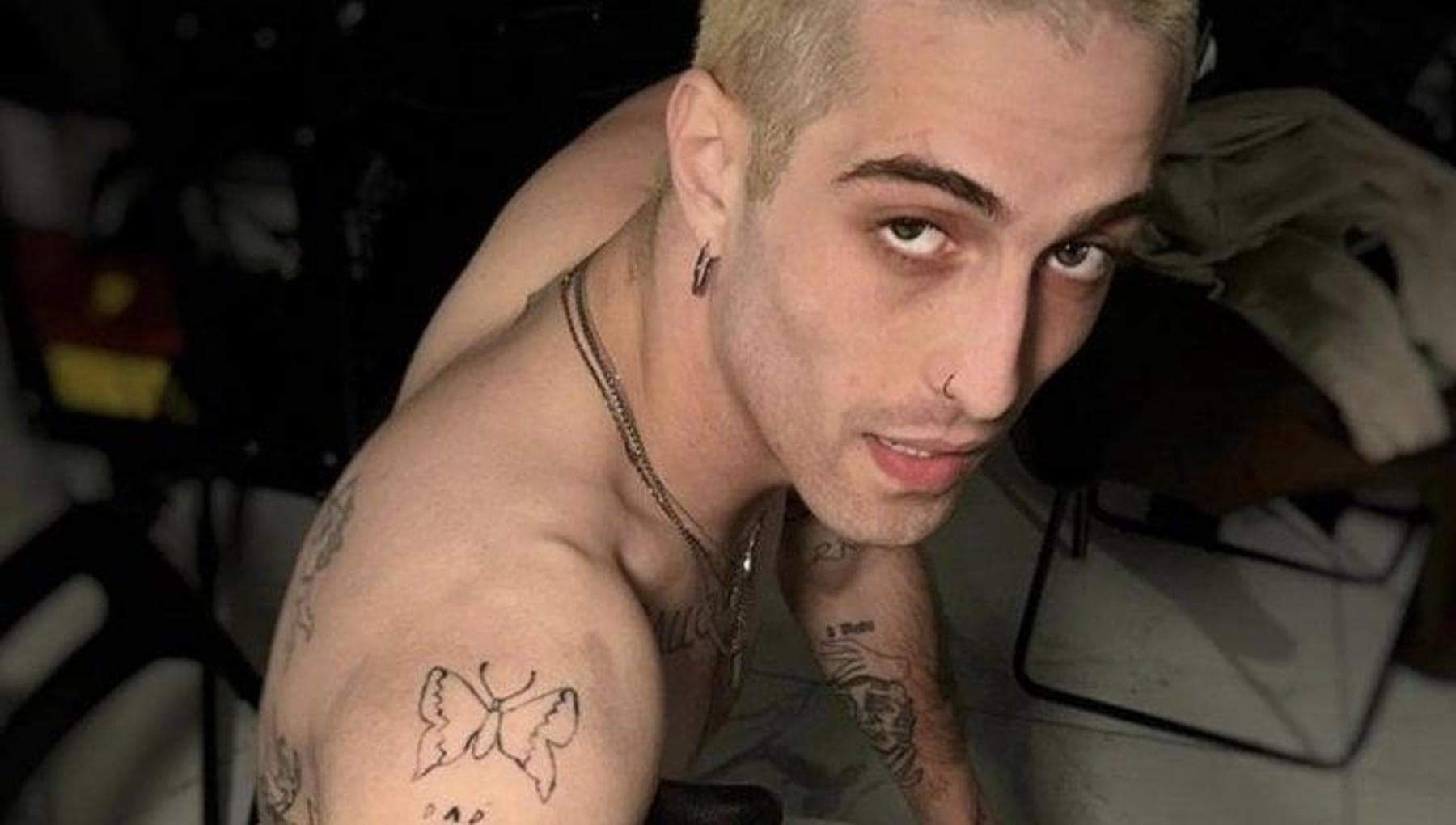 Damiano David tattoos: Eren Jaeger shown in human and Titan forms on the upper arm