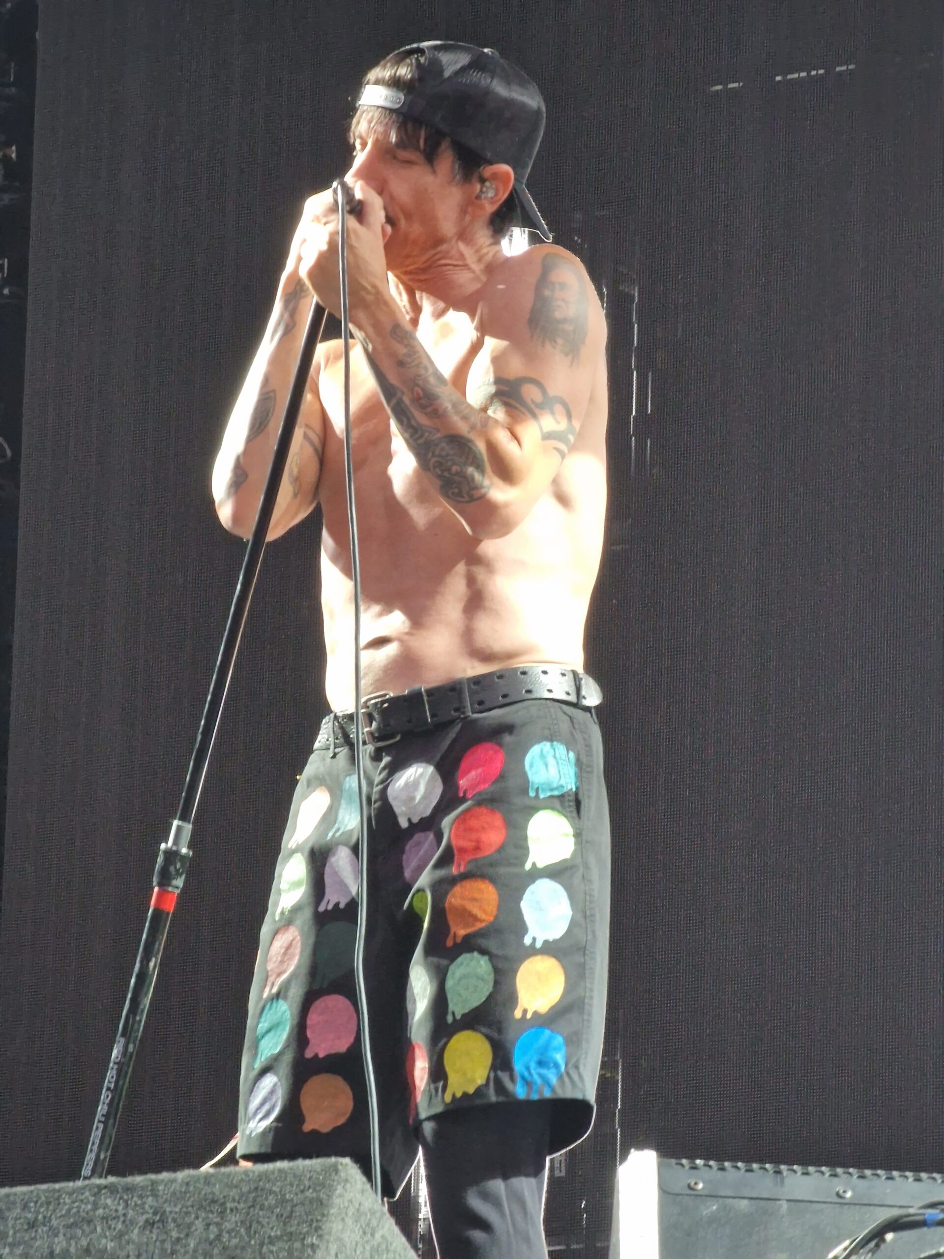 Anthony Kiedis showing arm and wrist tattoo areas