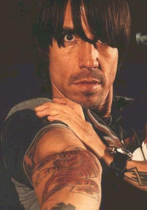 Anthony Kiedis tiger tattoo on the upper and inner arm