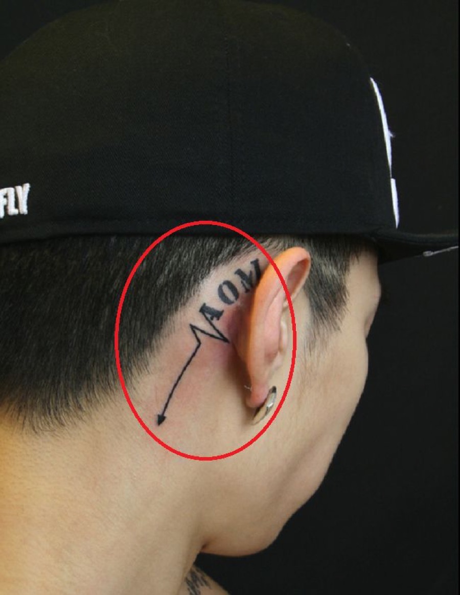 Jay Park tattoos: AOM crew tattoo behind the right ear