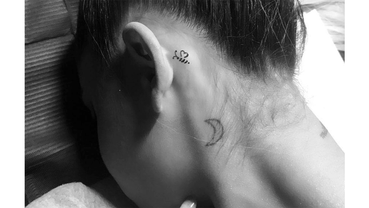 Ariana Grande Manchester bee tattoo behind her ear