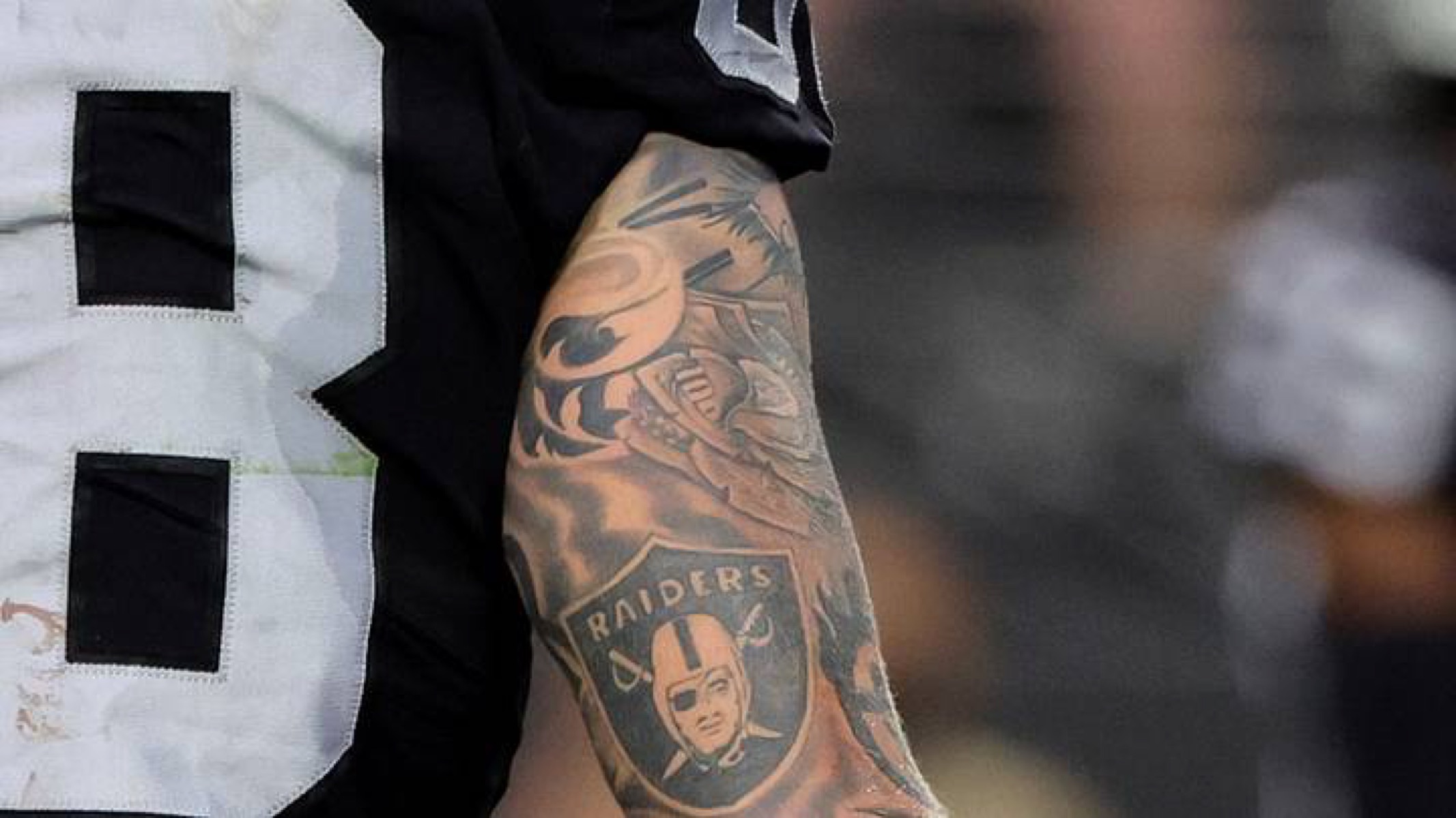 Maxx Crosby tattoos: first wrist name and birth year tattoo