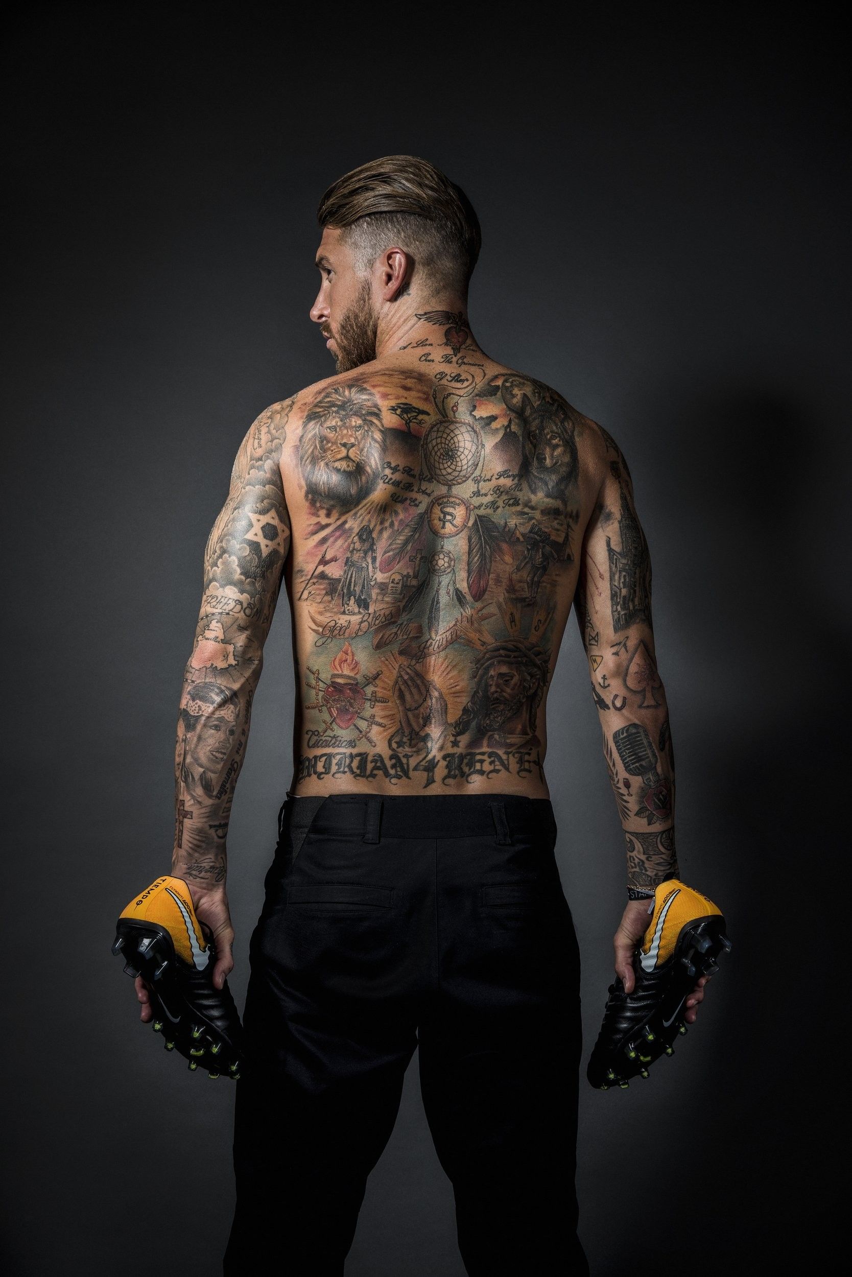 Sergio Ramos detailed back tattoo with lion and religious imagery