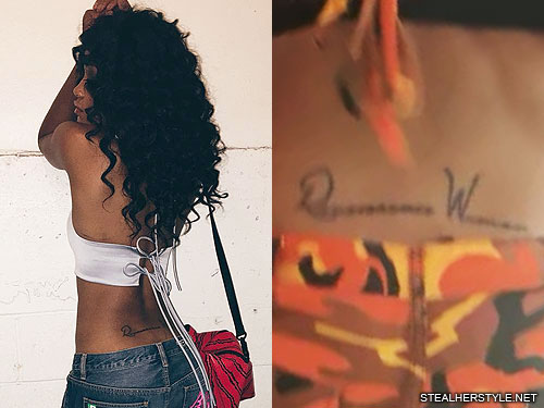 Keke Palmer tattoos: Renaissance Woman lettering tattoo on Keke Palmer’s lower back