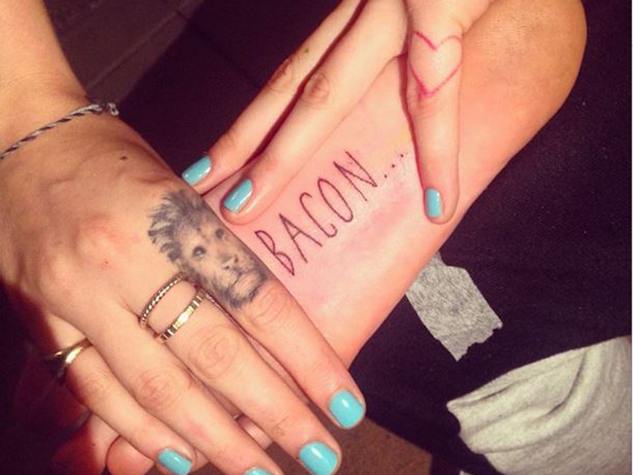 Cara Delevingne Bacon tattoo on the sole of her foot