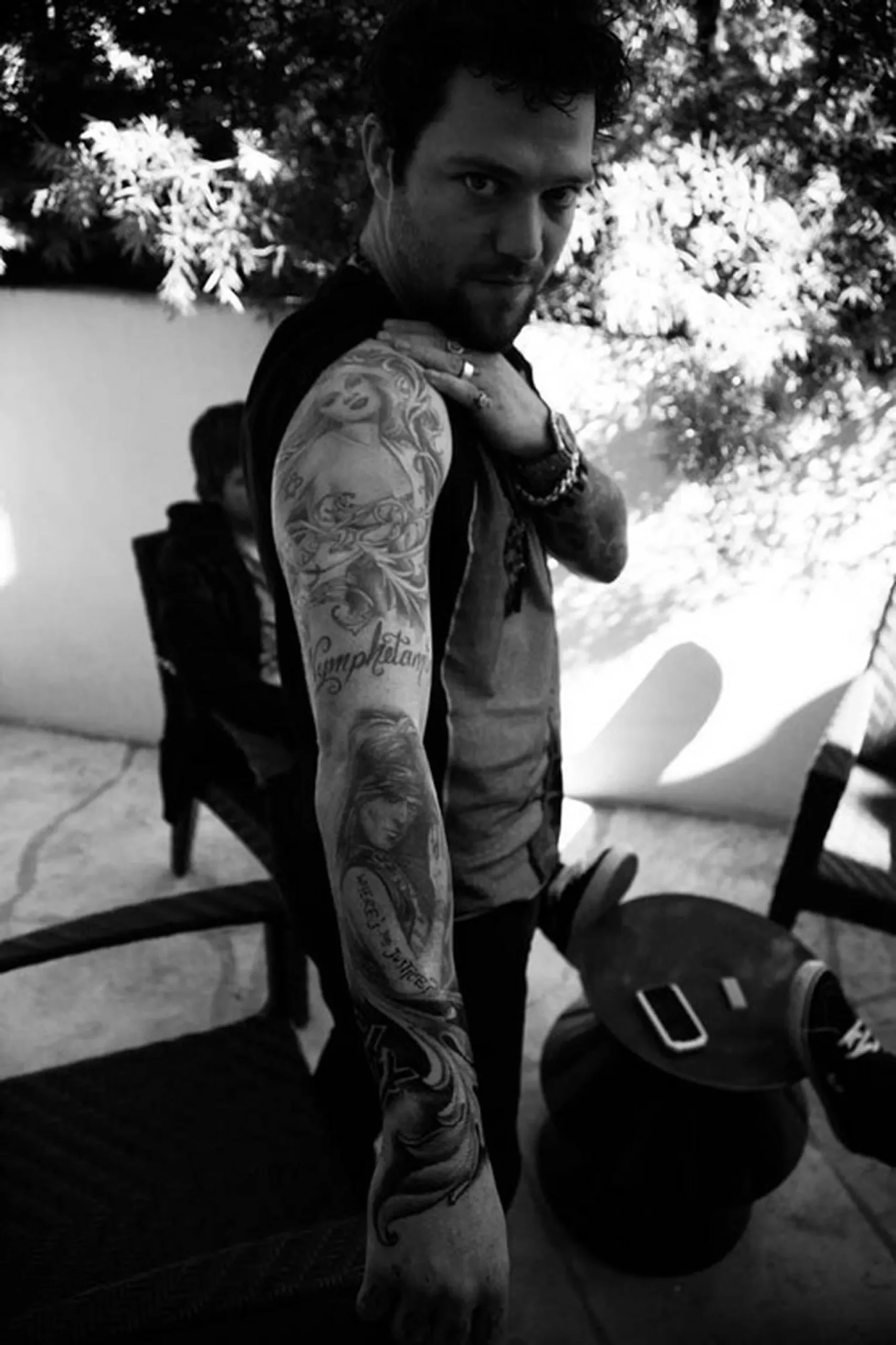 Bam Margera full arm tattoo sleeve with lettering and portraits