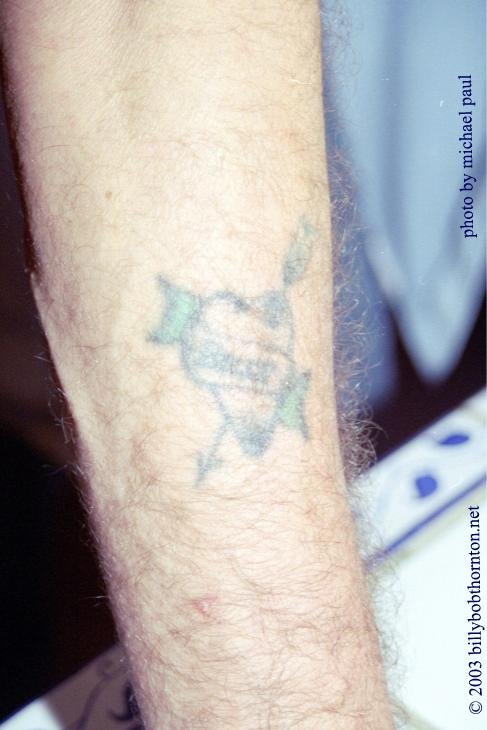 Billy Bob Thornton heart and arrow first tattoo on forearm