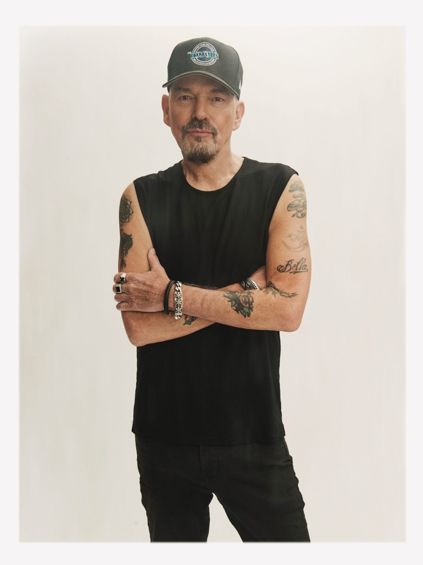 Billy Bob Thornton in a sleeveless portrait with visible tattooed arms