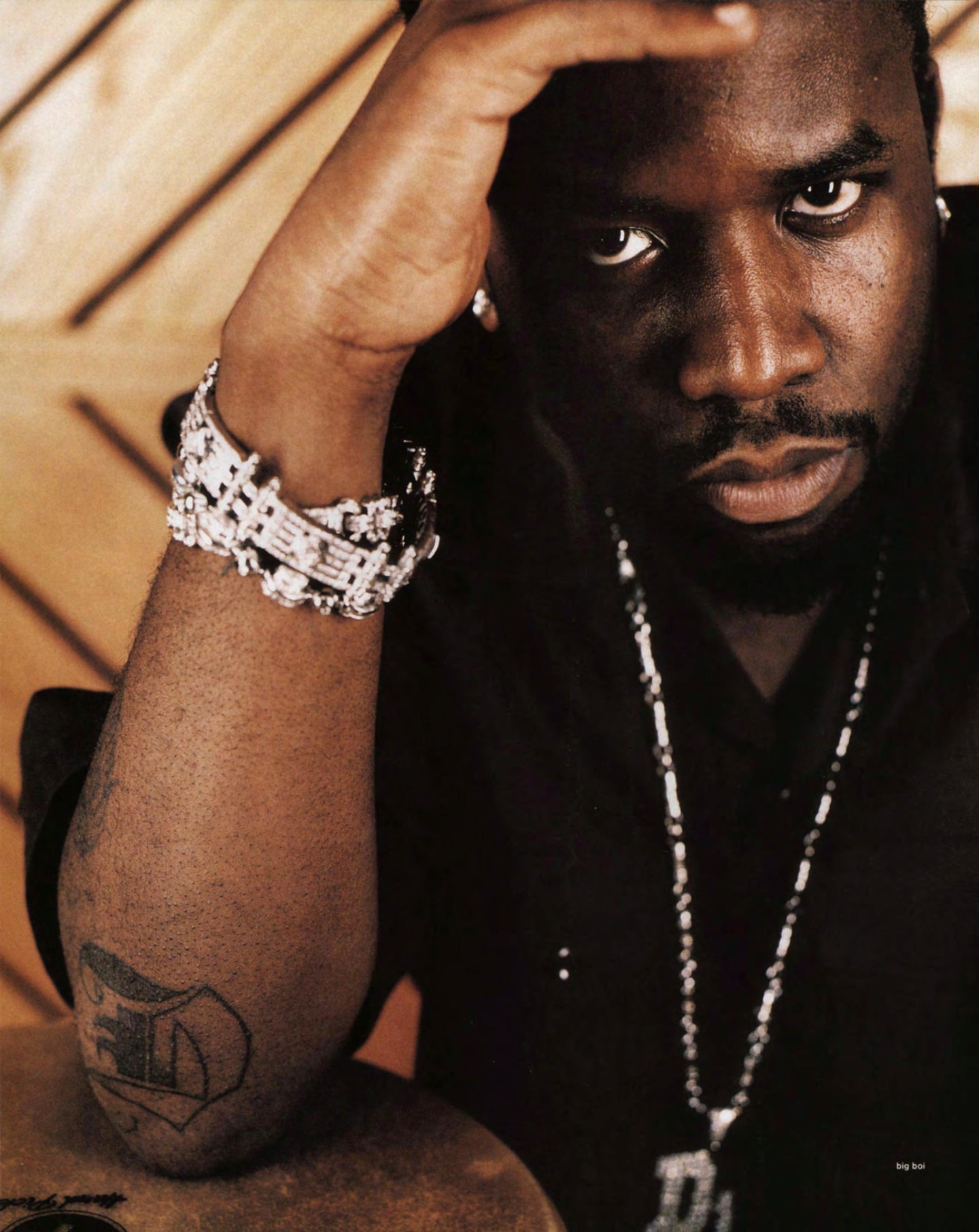 Big Boi showing a forearm tattoo