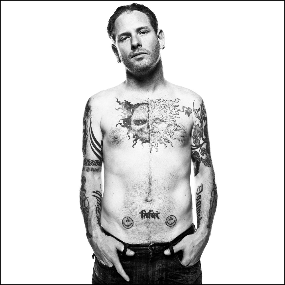 Corey Taylor tattoos: full torso showing the chest, arms and abdomen designs