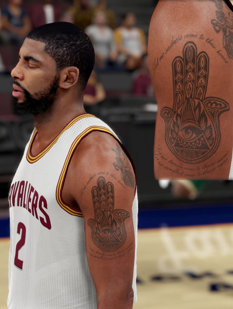 Kyrie Irving tattoos: large arm close-up showing the Hamsa hand, eye and lines of text