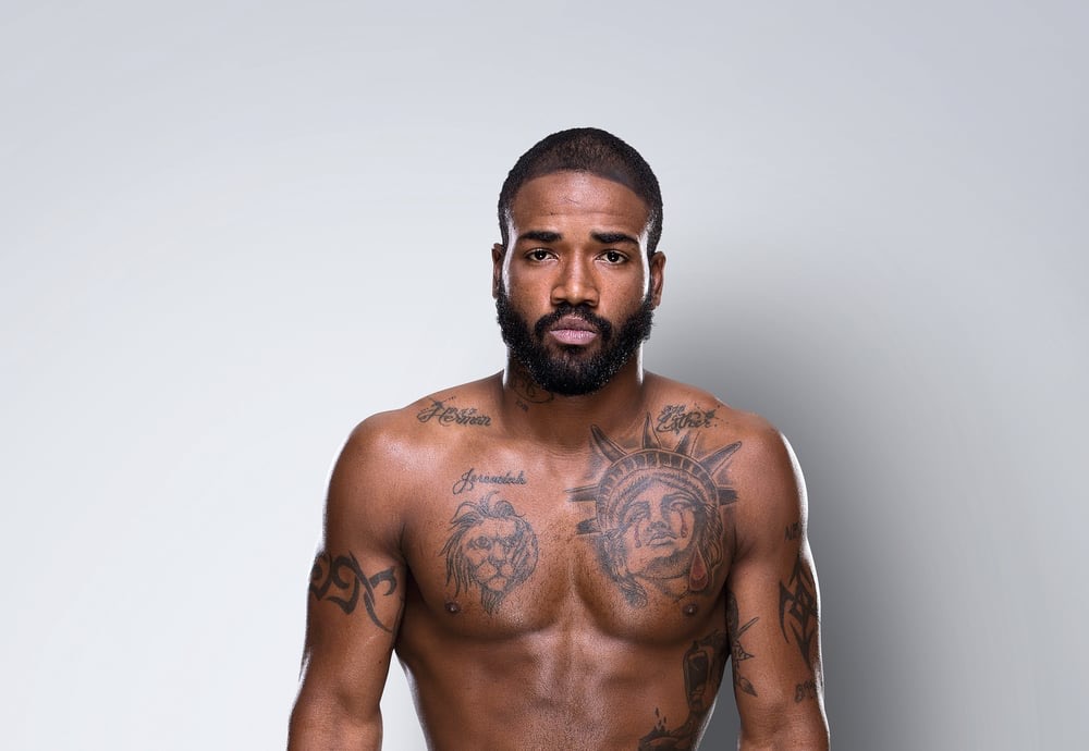 Bobby Green tattoos: sharp portrait showing the crying Statue of Liberty chest tattoo and nearby chest ink