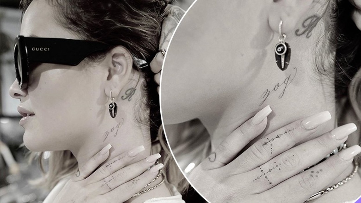 Rita Ora tattoos: close photograph showing the cursive zog tattoo below the ear