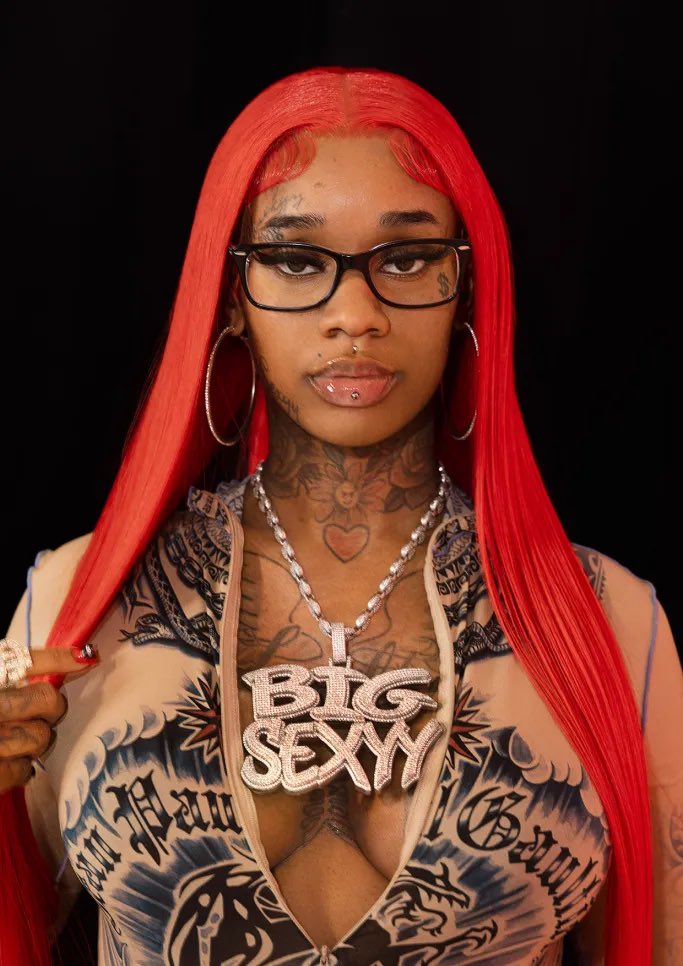 Sexyy Red tattoos: close portrait showing the neck and upper-chest tattoos