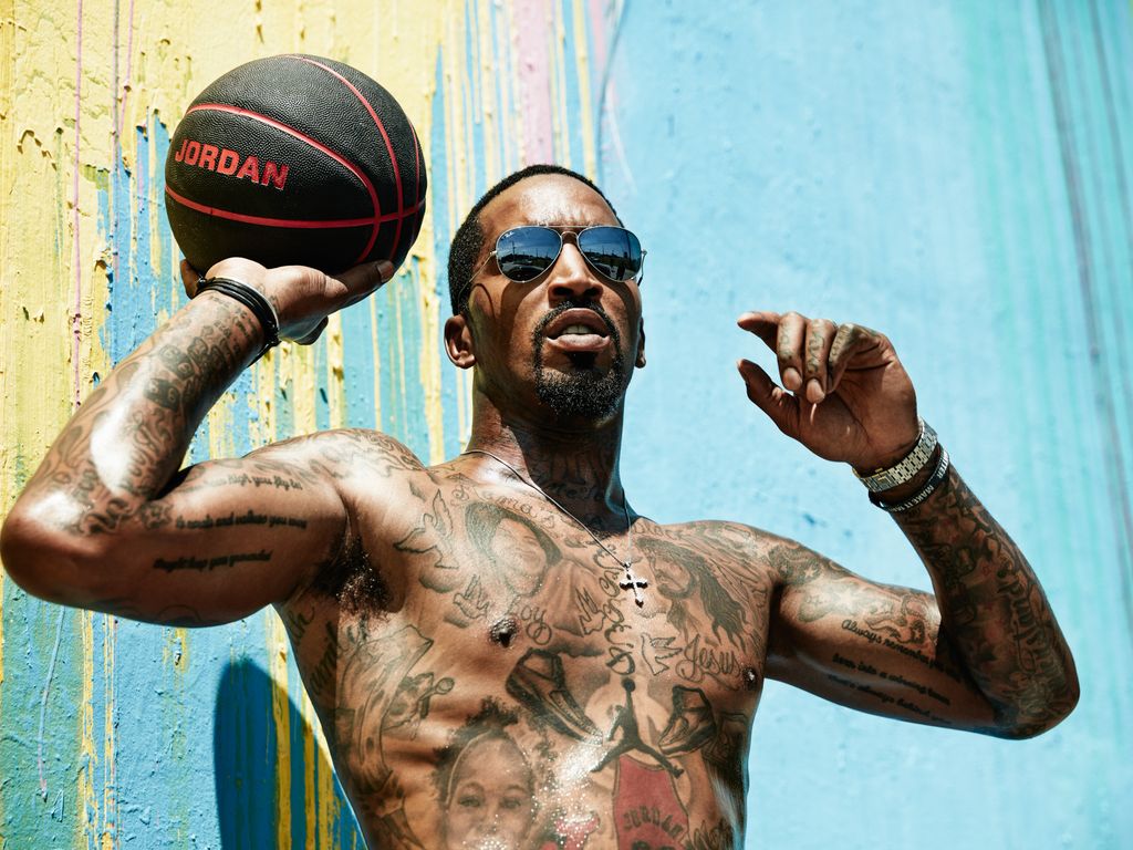 J.R. Smith tattoos: different editorial portrait showing the dense chest and arm layout