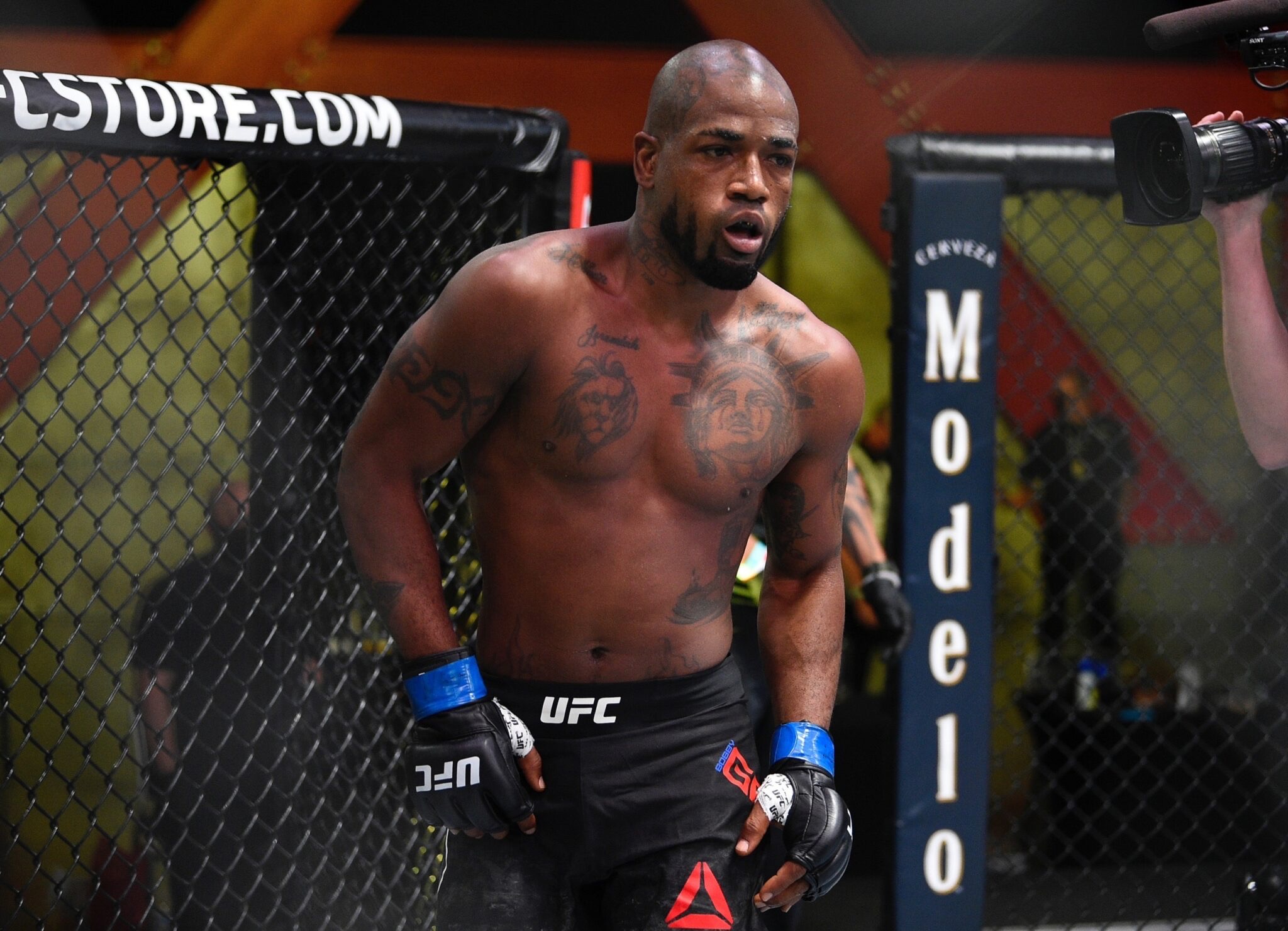 Bobby Green tattoos: large high-resolution photograph showing the back lettering and upper-body tattoo layout