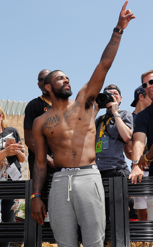 Kyrie Irving tattoos: distinct Olympic-era photograph showing the arm and side-body ink from a wider angle