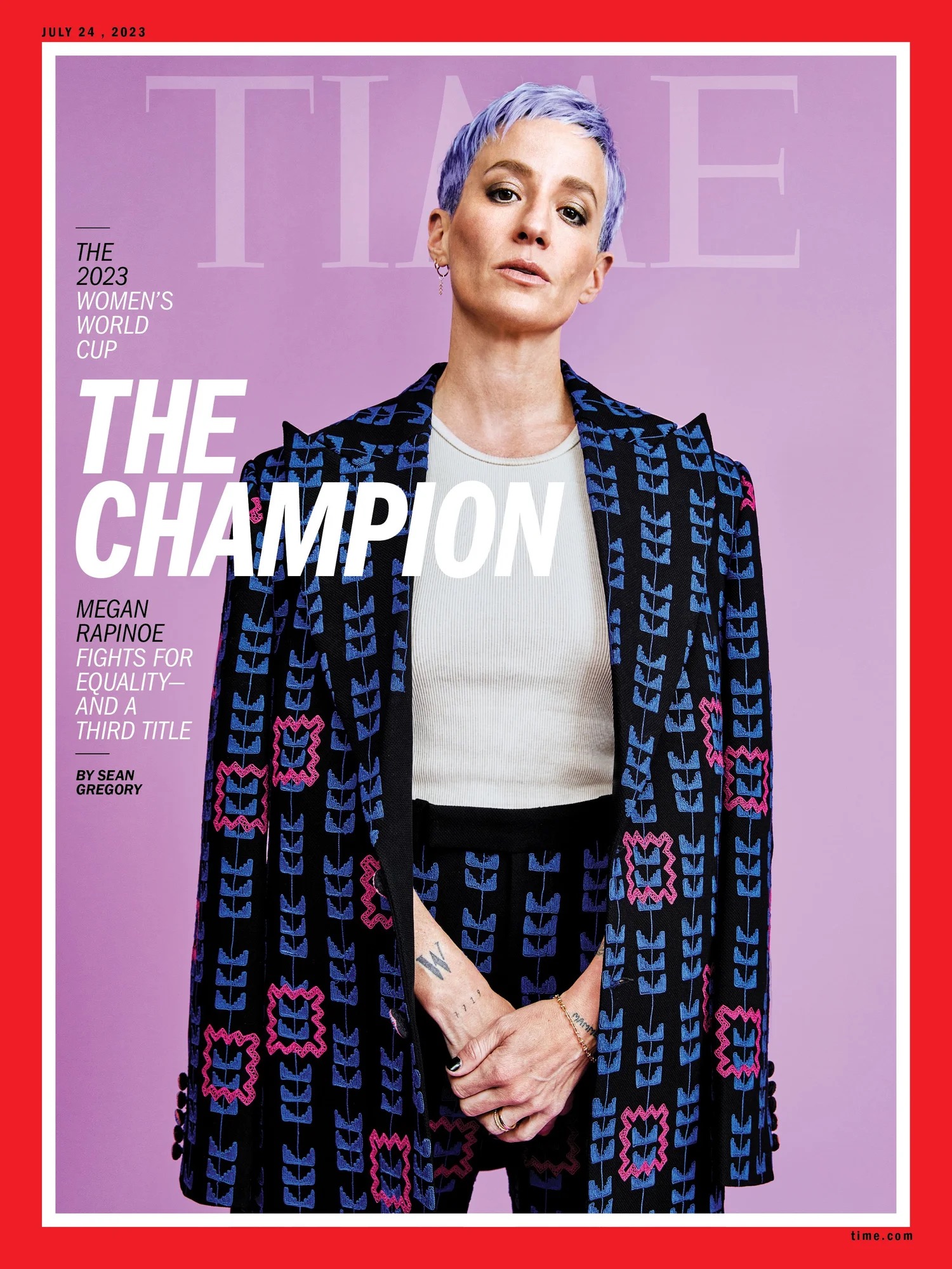 Megan Rapinoe tattoos: large sharp Time cover showing the hand and wrist lettering close up