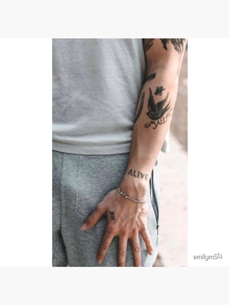 Calum Hood ALIVE forearm tattoo