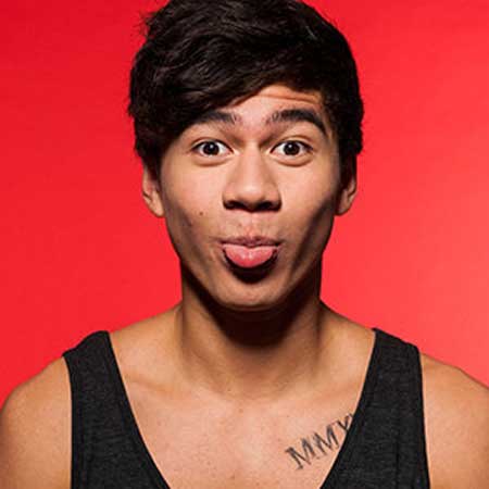 Calum Hood feather horseshoe and chest tattoos