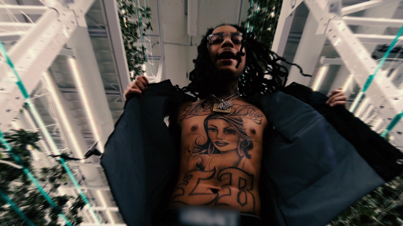 YBN Nahmir chest tattoo portrait showing the large woman design