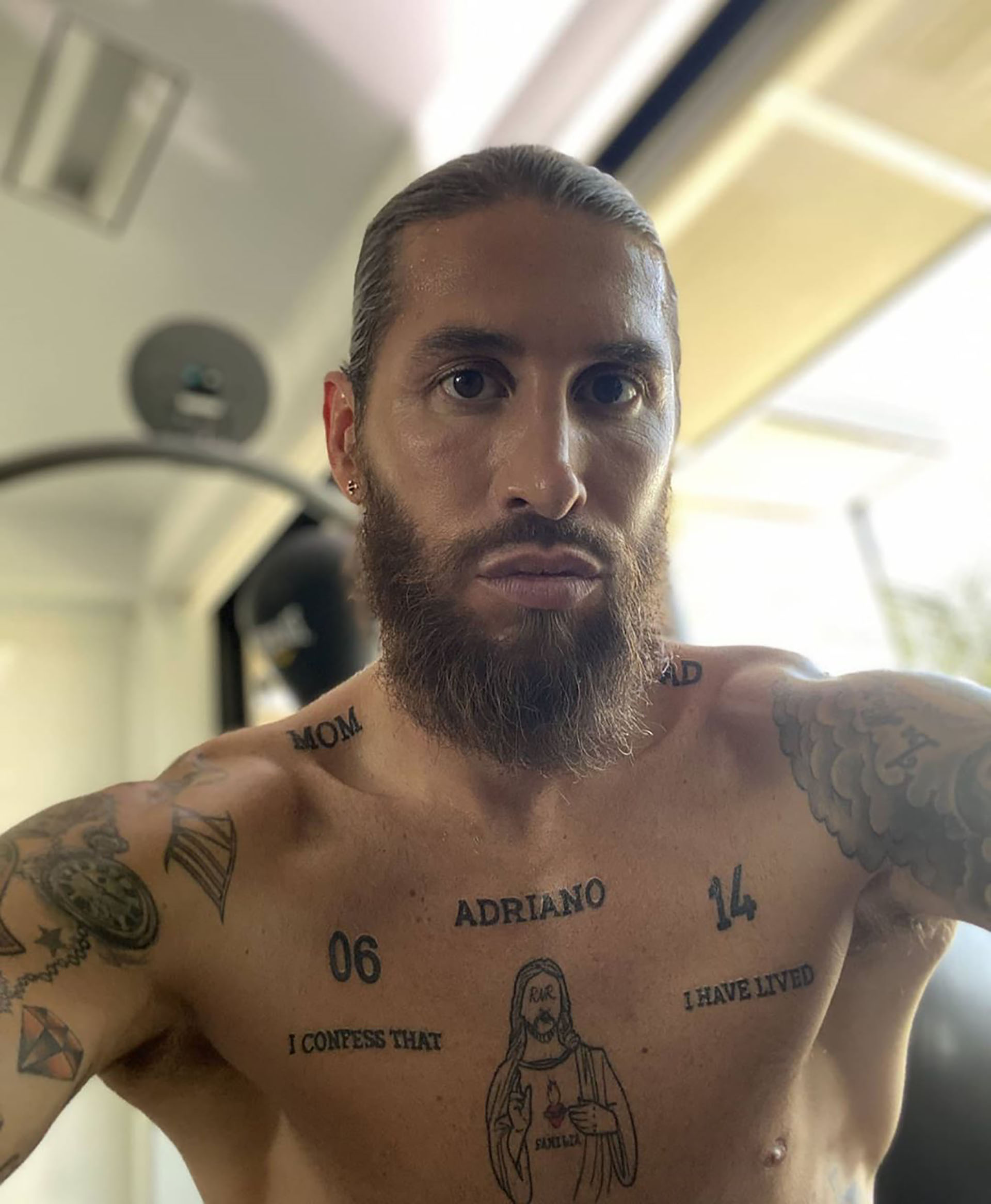 Sergio Ramos Jesus chest tattoo and 1986 tattoo