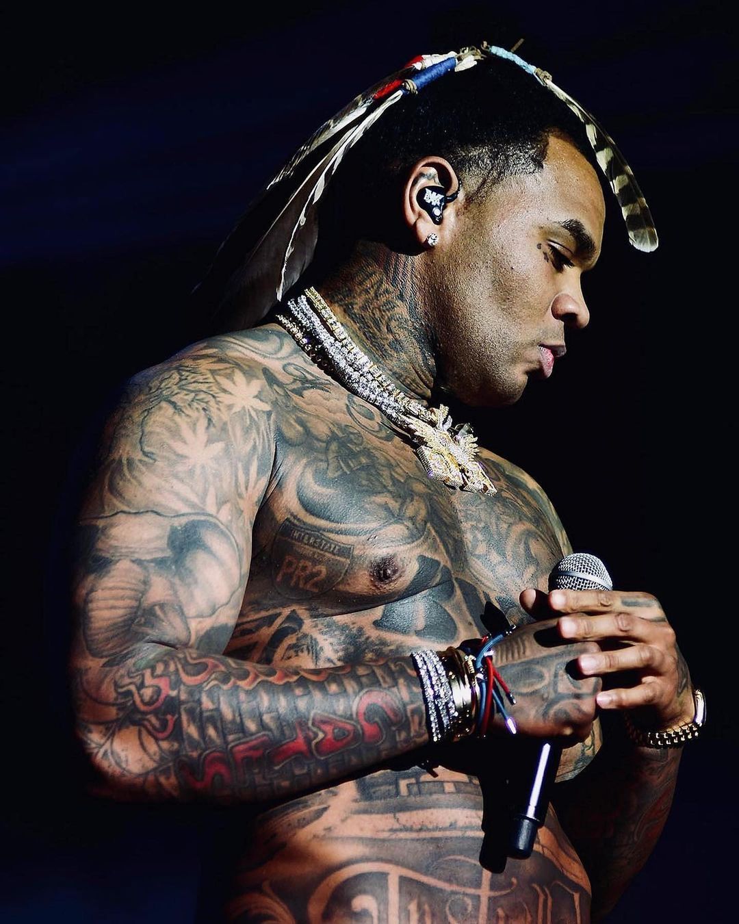 Kevin Gates Elvis chest tattoo and upper body tattoos