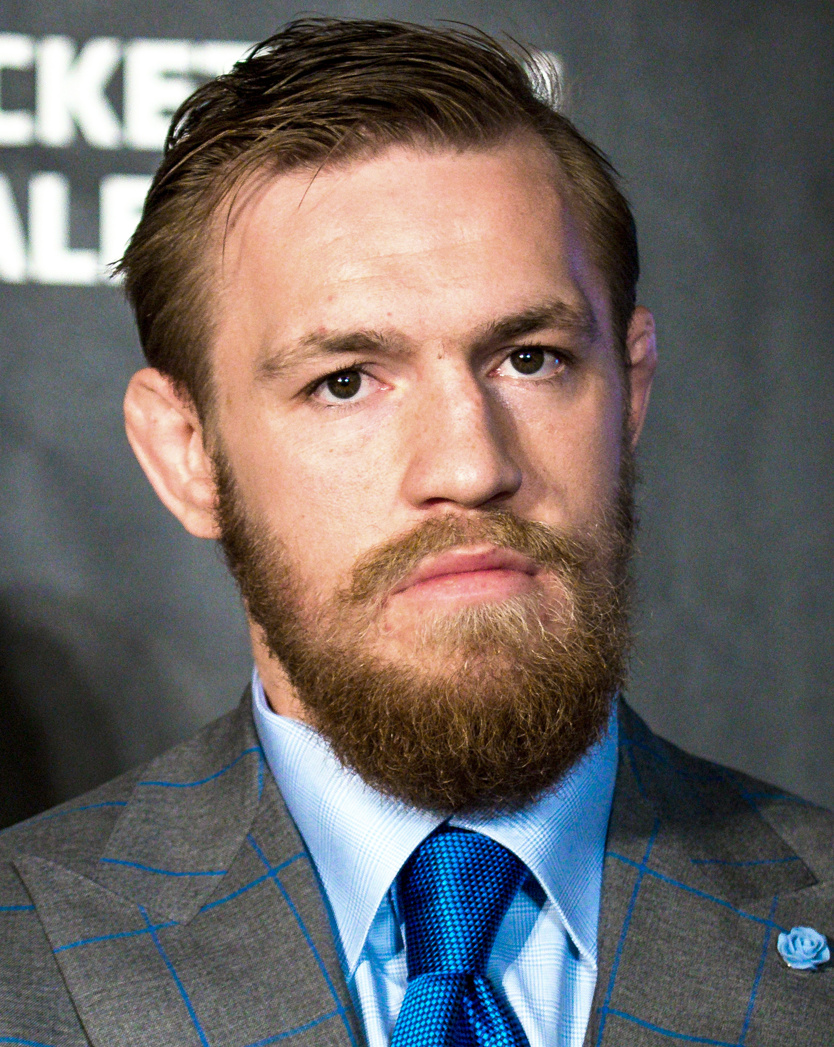 Conor McGregor in 2015 with his gorilla chest tattoo and torso lettering visible