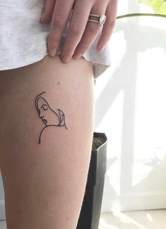 Sophie Turner tattoos: spine and side tattoos