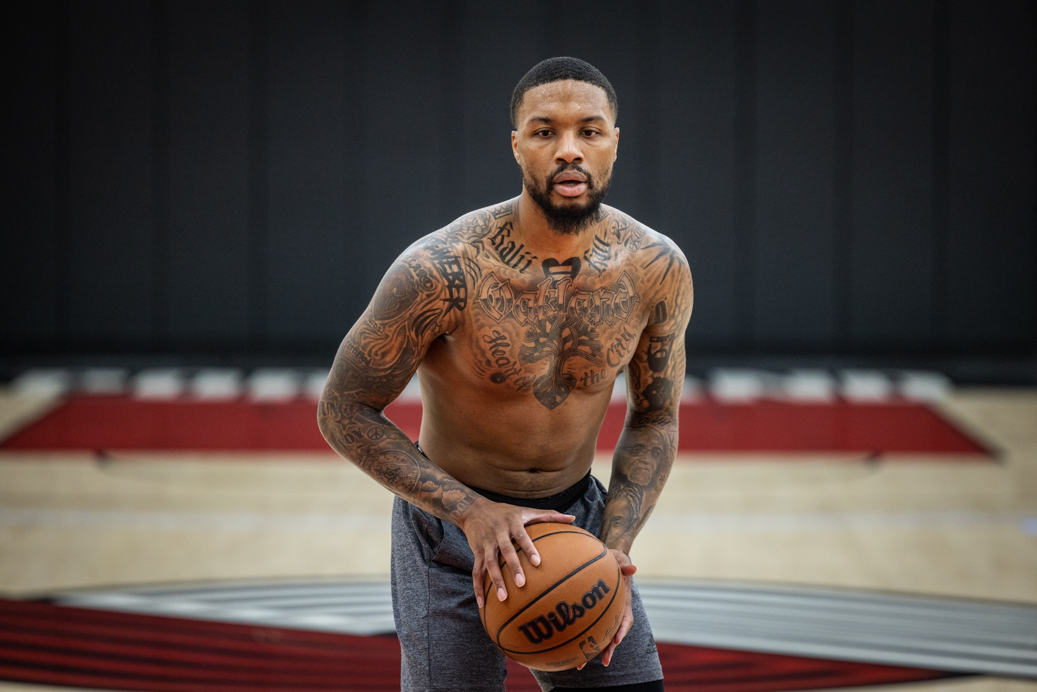 Damian Lillard shirtless training chest and arm tattoos