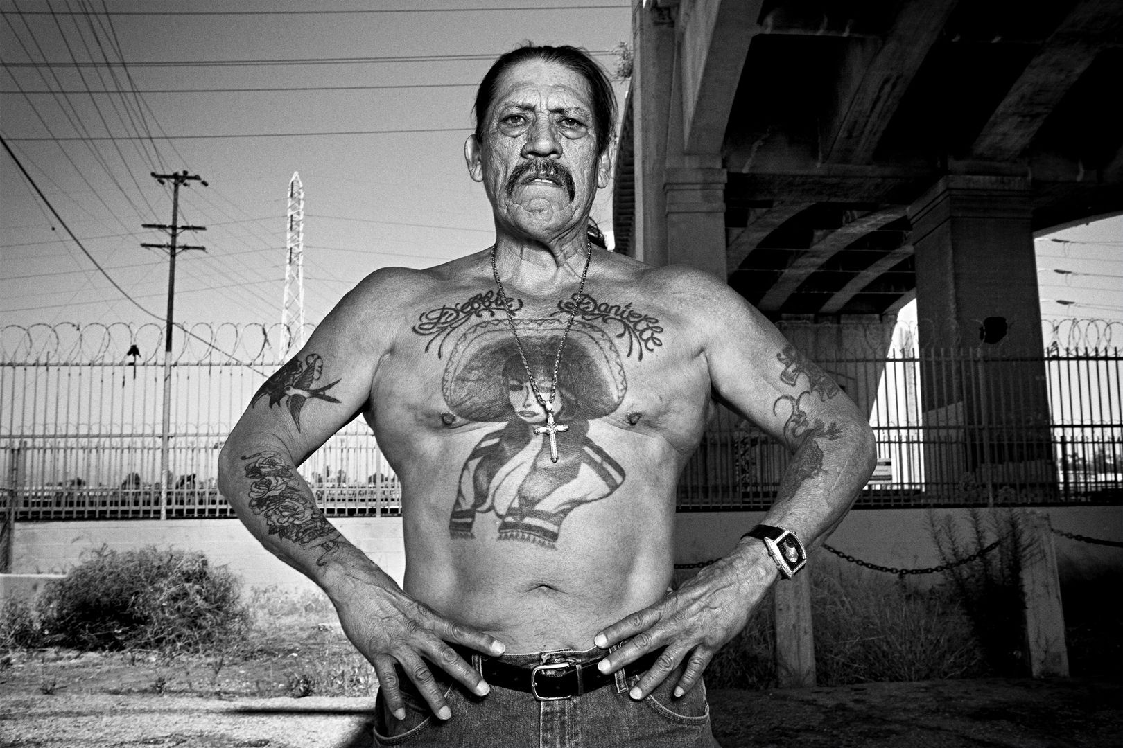 Danny Trejo arm tattoos and older prison ink