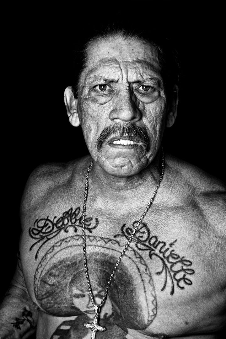 Danny Trejo family names tattoo above his chest piece