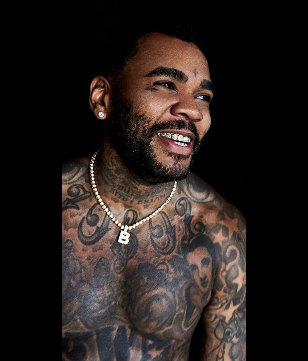 Kevin Gates house tattoo on stomach