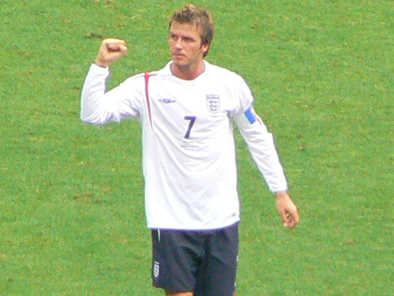 David Beckham with visible tattoos in a public appearance