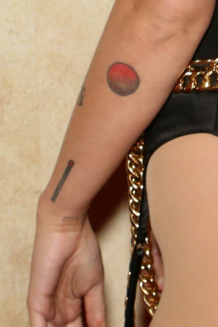 Halsey tattoos: Matchstick and Mars forearm tattoos
