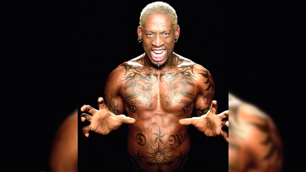 Dennis Rodman showing facial and upper-body tattoos