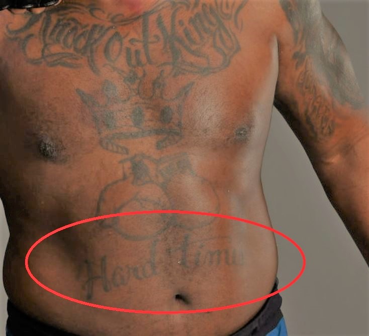 Derrick Lewis hard times chest tattoo