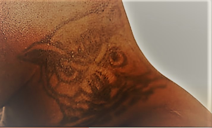 Derrick Lewis owl neck tattoo
